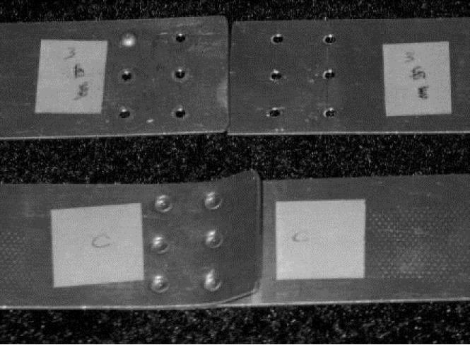 Two coupons with properly set rivets after pull to failure